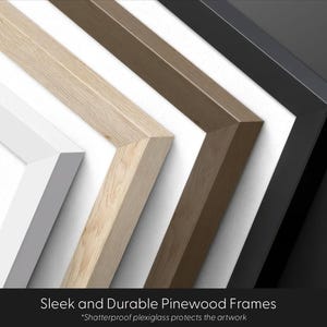 May include: Close-up of four different colored picture frames: white, light wood, medium brown, and black. The frames are made of pinewood and have a sleek, modern design. Text at the bottom reads "Sleek and Durable Pinewood Frames".