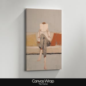 May include: Canvas print of a person reading a book on a sofa. The person wears a white shirt and striped trousers. The background has muted yellow, orange, and blue tones. The artwork is unframed.