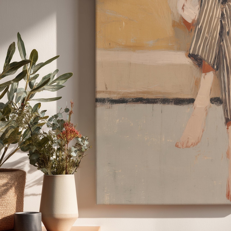 May include: Abstract canvas art featuring a figure in striped clothing and bare feet. The painting uses a muted palette of beige, grey, and yellow. A vase with dried flowers and greenery is in the foreground.