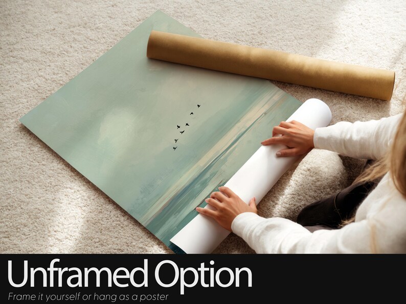 May include: A rectangular wall art poster featuring a landscape illustration of a calm sea with a sandy shoreline and a flock of birds flying in the sky. The color palette consists of muted sage green, soft blue, and beige tones.