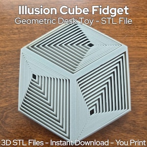 May include: A gray Illusion Cube Fidget, a geometric desk toy. The cube features a nested square design, creating an optical illusion. Text on the image reads "Illusion Cube Fidget, Geometric Desk Toy - STL File" and "3D STL Files - Instant Download - You Print".