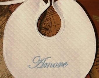 Handcrafted bib, personalized with the word "love" written on it