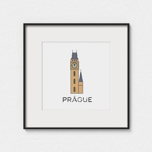 May include: A framed print featuring a minimalist illustration of a clock tower with a smaller adjacent tower. The clock tower is tan with a dark blue roof and a clock face. The word "PRÁGUE" is printed in black below the towers.