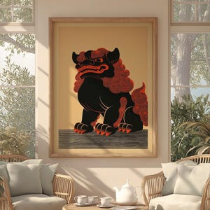 May include: A framed print featuring a stylized black and red Shisa dog, a traditional Ryukyuan guardian. The artwork depicts the mythical creature with a fierce expression and intricate details, set against a warm, neutral background.