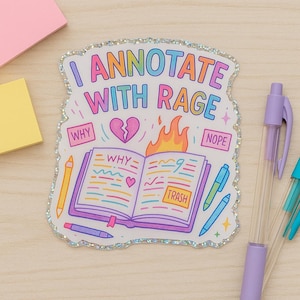 May include: A sticker with a rainbow-colored text that says "I annotate with rage". The sticker features a cartoon illustration of an open book with a broken heart, a fire, and the words "Why", "Trash", and "Nope".