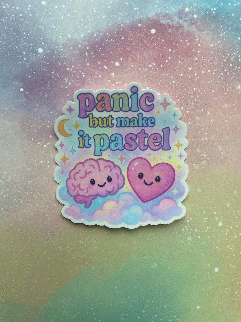 May include: A pastel pink and blue sticker with a brain and heart with smiling faces. The sticker says "panic but make it pastel".