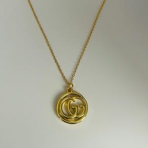 Geüpcycleerde bedelketting met groot cirkellogo
