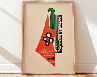 May include: A framed poster featuring a stylized graphic design with a red geometric shape, a green head covering, and black gear icons. The artwork includes vertical black text and a green wheat stalk illustration on a light beige background.