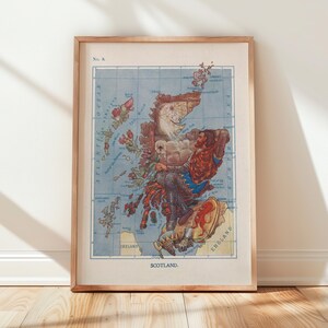 May include: A framed vintage map of Scotland, featuring a detailed illustration with a light blue background and a wooden frame. The map includes illustrations of figures and landmarks, with the word "Scotland" at the bottom.