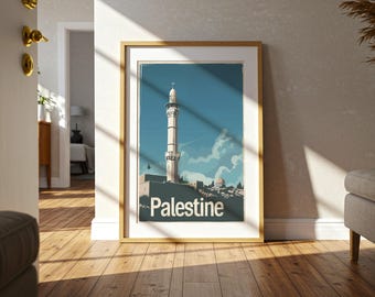 May include: A framed art print featuring a tall minaret against a blue sky with clouds. The print has a vintage travel poster style, with the word "Palestine" in white at the bottom. The frame is a light wood color.