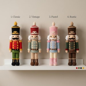May include: Four crocheted nutcracker dolls arranged in a row, labelled 1. Classic, 2. Vintage, 3. Pastel, and 4. Rustic. Each doll features a tall hat, a moustache, and a uniform. The dolls are coloured in red, green, black, cream, pink, and brown.