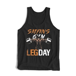 May include: Black tank top with the text "Sayan's Gym LEG DAY" in orange and white. The graphic features a muscular figure lifting weights. The tank top is sleeveless and made of a soft material.