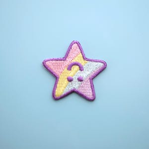 Cute pastel rainbow star patch with upside down face - Iron on embroidered