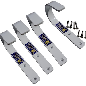 May include: Four white metal hooks with a curved design and a flat top, accompanied by screws. Each hook has a blue and yellow sticker with text. The hooks are designed for utility purposes.