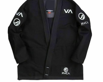 May include: Black Jiu-Jitsu Gi with white RVCA logo patches on the sleeves and chest. The Gi has a black belt and a white wave logo on the sleeves.
