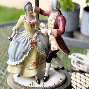 Vintage Victorian Porcelain figurine lamp with brass base and hardware.