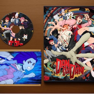 Dandadan – Limited Collector’s Tribute Set | Anime Display Case, Lore Pack, 10 Stickers, Dummy Disc, Mini Poster (No Anime)