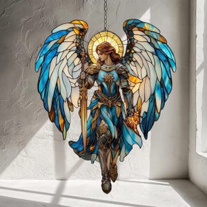 May include: Stained glass angel with outstretched wings, holding a sword and a golden object. The angel is depicted in shades of blue, gold, and white, with a halo around its head. The artwork is hanging from a chain.