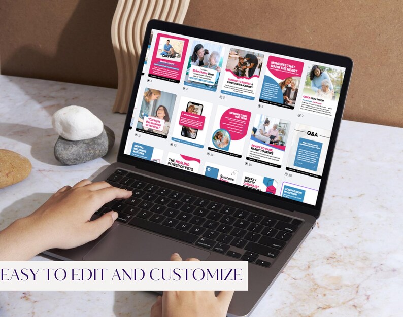 May include: A laptop displaying a series of social media templates with pink and blue accents. The screen shows various layouts with images and text, including the phrase "EASY TO EDIT AND CUSTOMIZE" at the bottom. The laptop is on a marble surface.