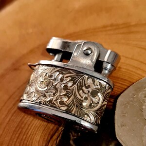 ladies Tiny Gold finish vintage petrol lighter in Mint working Condition, a stunner a piece of art, Smallest lighter in the world maybe.