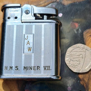 WW2 era H.M.S. Miner VII Ronson Whirlwind vintage lighter once belonging to crew member.in Great working condition and boxed