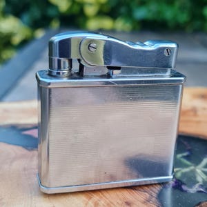 A Historic piece The Brother Supermatic Best Made. Petrol lighter 1955 aporox .A nice useable Japanese mans lighter.