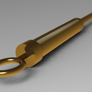 Puede incluir: Una varilla de metal de color dorado con una sección roscada y un anillo en un extremo.