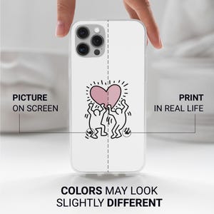 May include: White phone case featuring a pink heart design held by two stick figures, with a dotted outline. The case has a clear border and the text "PICTURE ON SCREEN" and "PRINT IN REAL LIFE". The text "COLORS MAY LOOK SLIGHTLY DIFFERENT" is also visible.