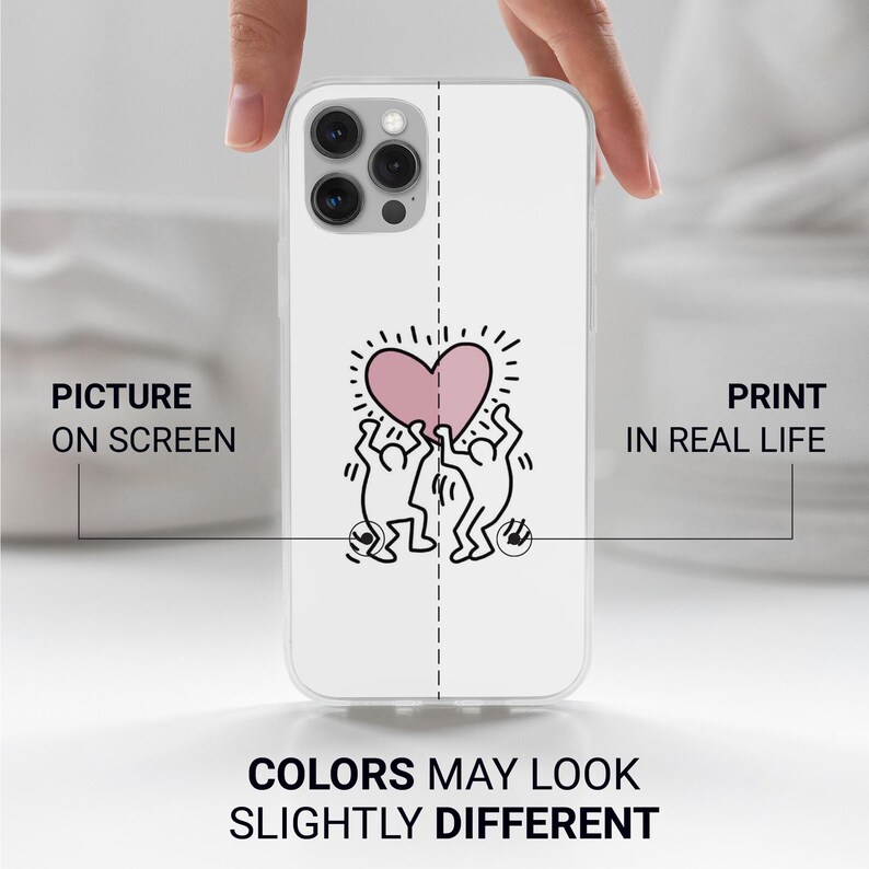 May include: White phone case featuring a pink heart design held by two stick figures, with a dotted outline. The case has a clear border and the text "PICTURE ON SCREEN" and "PRINT IN REAL LIFE". The text "COLORS MAY LOOK SLIGHTLY DIFFERENT" is also visible.