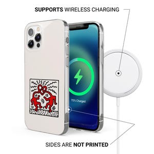 May include: A white iPhone case with a red and black graphic of two figures embracing. The phone is charging wirelessly with a white charging pad. Text on the image reads: SUPPORTS WIRELESS CHARGING and SIDES ARE NOT PRINTED.