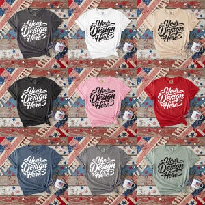 May include: A collection of nine t-shirts in various colors, including gray, white, beige, black, pink, red, blue, and green. Each shirt features the text "Your Design Here" in a stylized script. The shirts are arranged on a patriotic-themed background.