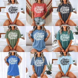 May include: Nine short-sleeved t-shirts in a range of colours, each with the text "Your Design Here" in a decorative script. The shirts are modelled, demonstrating the design on different coloured tees in a lifestyle setting.