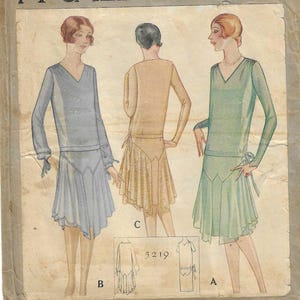 May include: Vintage McCall's Printed Pattern 5219 for a Ladies' and Misses' Slip-On Dress. The illustration shows three women in different colored dresses. The pattern is size 16.