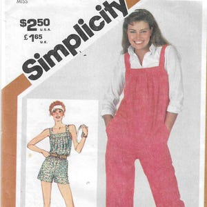 May include: A Simplicity sewing pattern envelope 5266 for size 12. The cover features a pink jumpsuit with wide straps and side pockets, and an illustration of a floral print romper with a belt. The text includes Simplicity 5266.