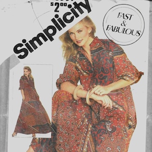 May include: Simplicity sewing pattern featuring a woman in a paisley print dress. The pattern includes the text "Fast & Fabulous" and "All Sizes in One Envelope". The pattern number is 5557.