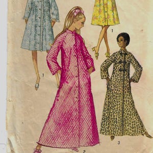May include: Simplicity sewing pattern 9074 for size 16, 38-inch bust. The envelope features illustrations of four different robe or coat styles: a light blue floral, a yellow floral, a long pink quilted robe, and a long leopard print robe.