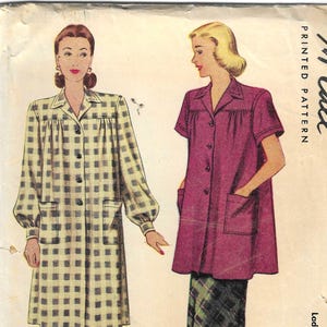 May include: Vintage McCall's printed sewing pattern featuring two smock designs. One smock is long-sleeved with a checkered pattern, the other is short-sleeved in a solid color. The pattern includes the text "6524" and "Ladies' & Misses' Smock Two Lengths".