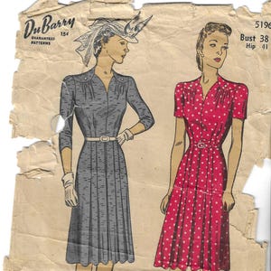 May include: Vintage DuBarry sewing pattern featuring illustrations of two dresses. One dress is gray with a belt, the other is red with white polka dots. The pattern includes the text "DuBarry Guaranteed Patterns" and measurements for bust and hip sizes.