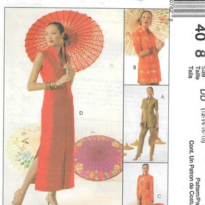 May include: McCall's sewing pattern envelope 408 featuring illustrations of dress alternatives. The designs include a sleeveless long dress, a tunic, a jacket with pants, and a long tunic with pants, all showcasing mandarin collars and side slits.