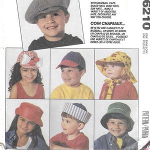 May include: A set of three ceramic mugs with a speckled, cream-colored glaze. Each mug features a different hand-painted floral design in shades of blue, green, and yellow. The mugs have a simple, rounded shape and a comfortable handle.