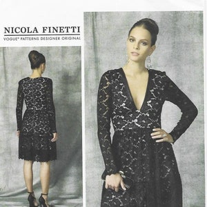 May include: A black lace dress with a deep V-neckline and long sleeves. The dress has a fitted bodice and a flared skirt. The model is wearing the dress with black heels. The pattern number is V1471 and the sizes are 14-16-18-20-22.