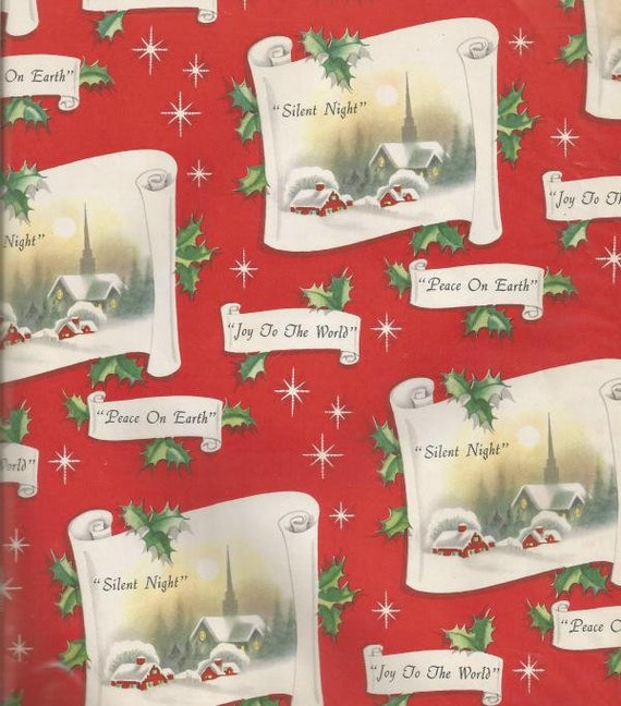 Vintage Christmas gift wrapping paper along with vintage Christmas cards..