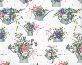 May include: A white background with a repeating pattern of blue watering cans filled with pink, white, and blue flowers. The watering cans have pink ribbons tied around the handles.