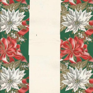 May include: A green and cream-colored gift wrap featuring a repeating pattern of red poinsettias and white flowers. The flowers are accented with gold leaves and small white berries. A cream-colored vertical stripe runs down the center.