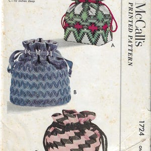 May include: Vintage McCall's printed pattern featuring three drawstring bags for huck weaving. The bags are in various colors and patterns, including green, red, and white, blue, and pink. The pattern includes measurements for each bag: A-9.5 inches deep, B-10.25 inches deep, and C-10 inches deep.