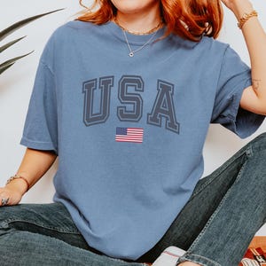 Retro USA Graphic Tee: Komfort Farben Vaterländisches T-Shirt