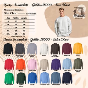 May include: A set of three ceramic mugs with a speckled, cream-coloured glaze. Each mug features a different hand-painted design: a blue and green leaf, a yellow flower, and a red berry. The mugs have a simple, modern design.