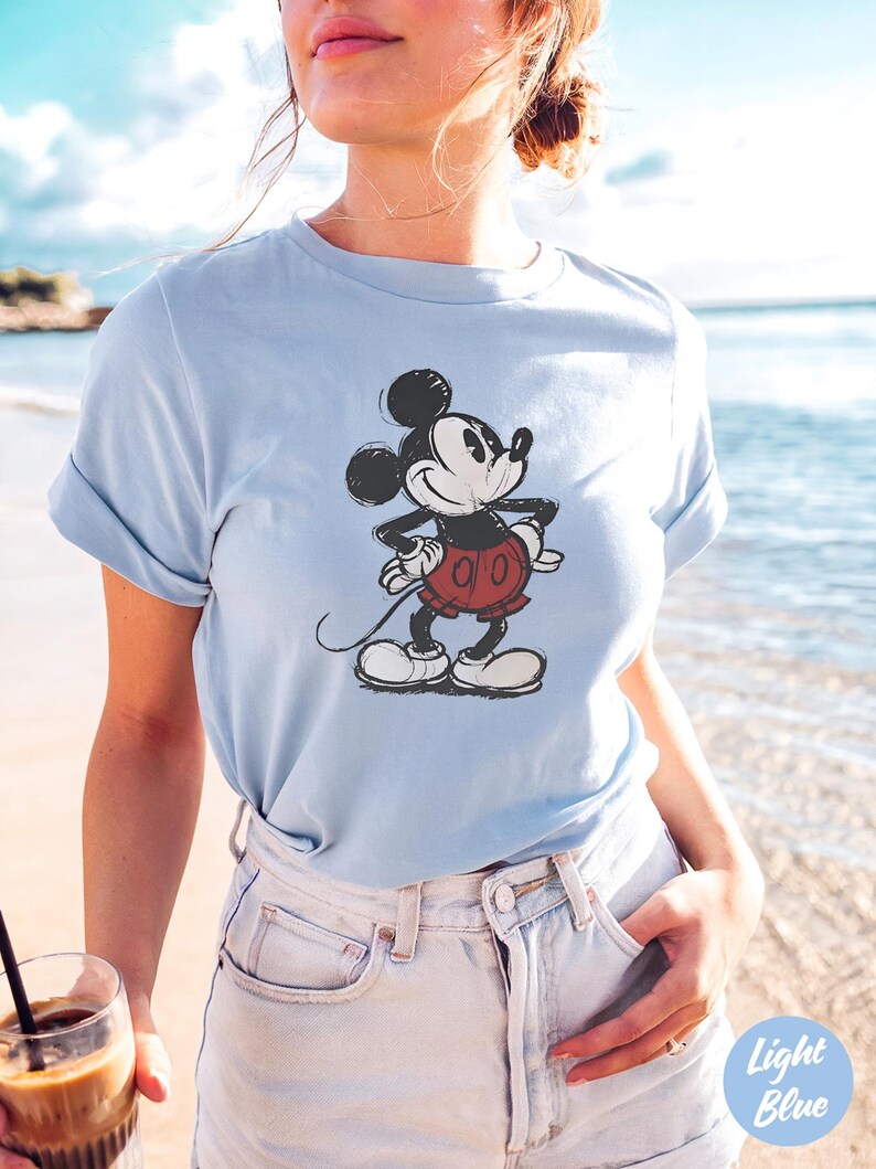 May include: A trio of ceramic mugs with a speckled, matte finish in cream, light grey, and dark grey. Each mug features a simple, minimalist design, ideal for tea or coffee.