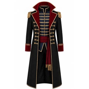 May include: A long black coat featuring a high collar with deep red velvet lining, gold-toned buttons, and gold braided trim. The garment includes shoulder epaulets with gold fringe, a dark blue inner vest section, and a red sash with gold tassels.