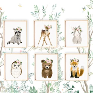 May include: Set of six watercolor animal prints featuring a raccoon, deer, rabbit, owl, bear, and fox. Each animal is wearing a floral crown and is depicted in a whimsical style. The prints are perfect for a nursery or child's room.